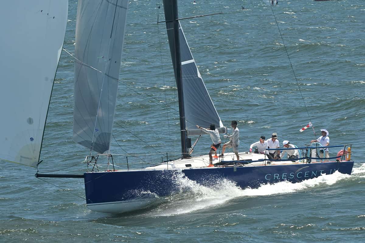 Sailing yacht Crescent with crew enjoying a day on the water.